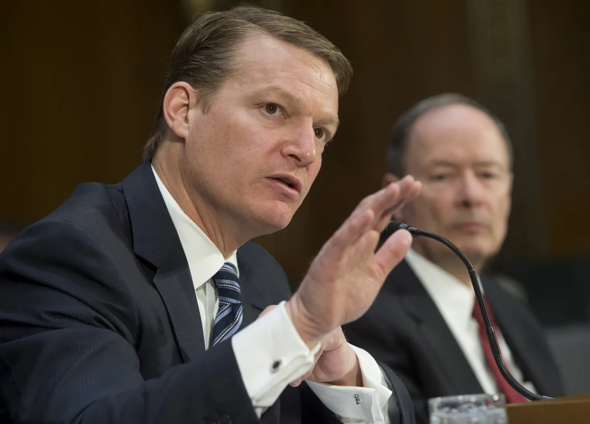 FireEye's chief executive testifying in Congress next to the former NSA director.